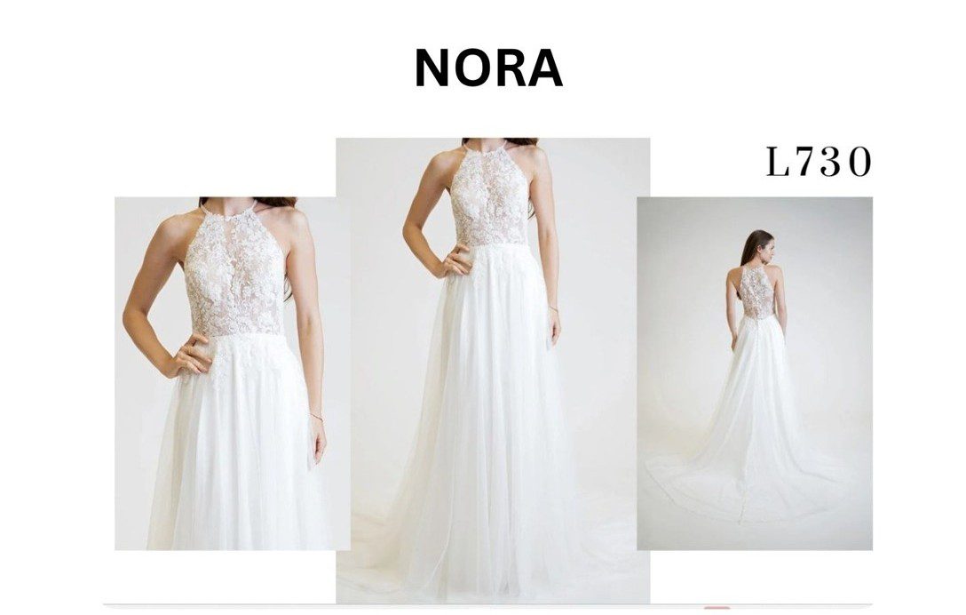 Elegant white wedding dress with lace bodice and flowing skirt.