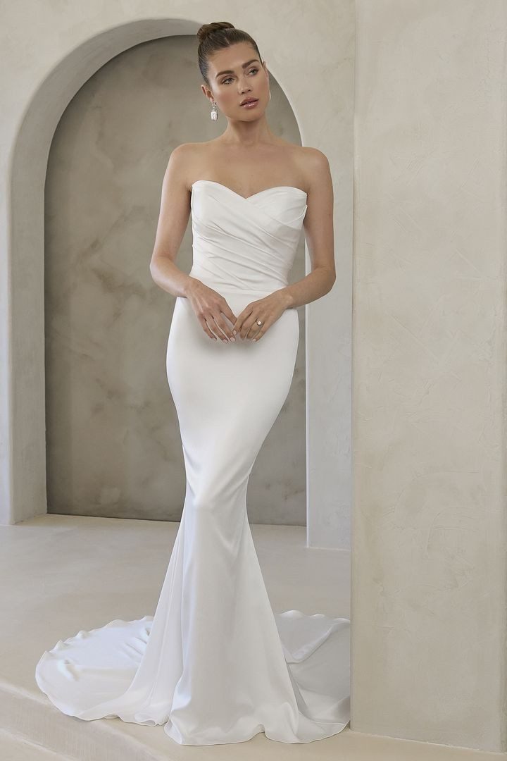 Elegant white strapless mermaid wedding gown with sweetheart neckline.